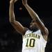 Michigan sophomore Tim Hardaway Jr. takes a three-point shot in the over time against Northwestern at Crisler Center on Wedensday. Melanie Maxwell I AnnArbor.com